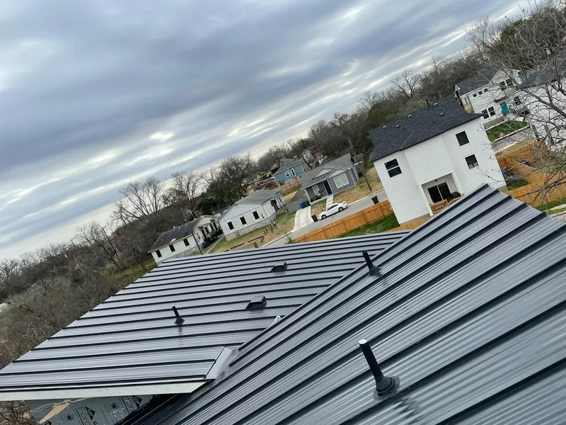 Standing seam metal roof panels with vents for Skylight Repair in Cushing